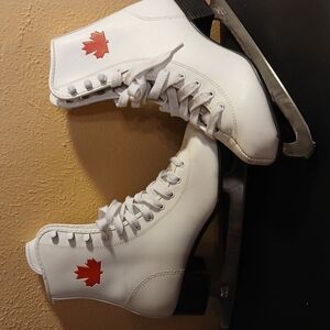 White and Red Lace Up Ice Skates with Beautiful Canadian Leaf